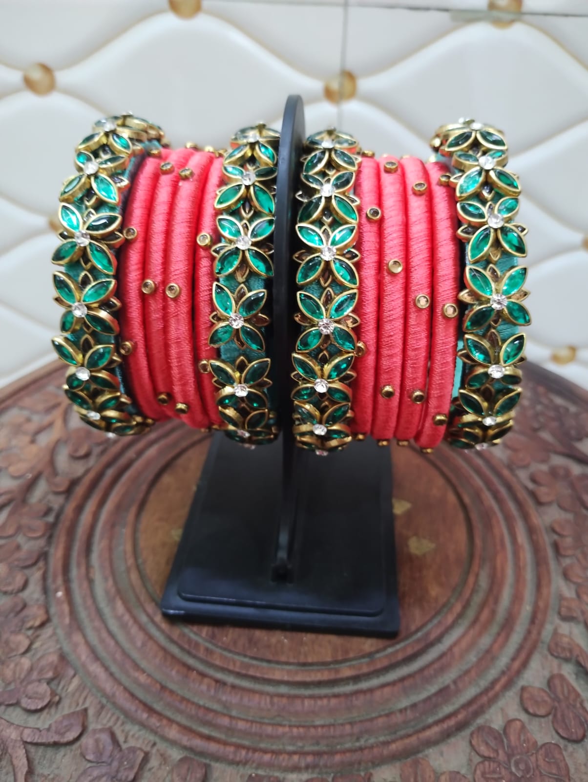 Lite pink thread with embossed green stone bangles
